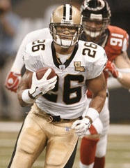 Deuce McAllister runs against the Falcons.